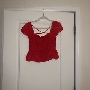 Forever 21 red dotted shirt. Size large and is cropped a little.